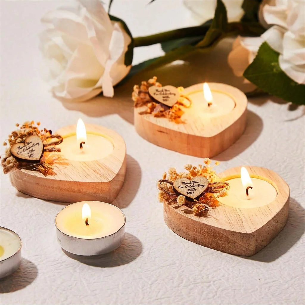 Heart-shaped scented candle favors in wooden holders, each with wick and floral tag
