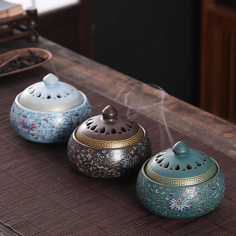 Enamel lotus incense burner trio with perforated lids in sky blue and retro brown tones