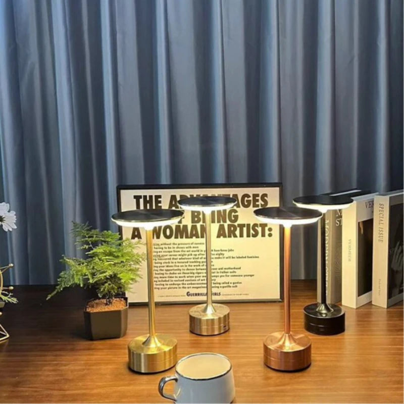 Tabletop cordless touch reading lamps with round light heads in gold and dark finishes