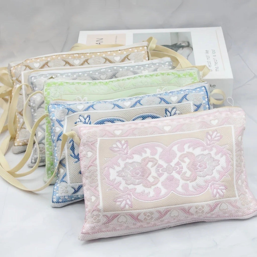 Prayer rug gift set with pastel embroidered pouches and folded prayer mat, bead tassel accents