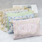 Prayer rug gift set with pastel embroidered pouches and folded prayer mat, bead tassel accents