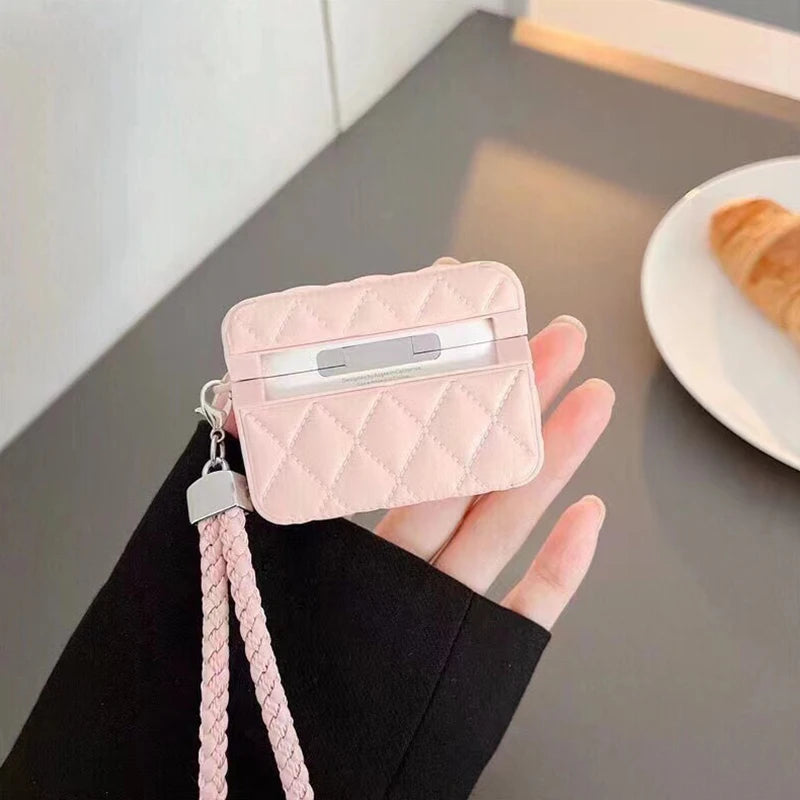 Lavender quilted leather AirPods case with lanyard strap and open lid