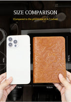 Cognac brown leather travel folio with embossed floral design, card slots visible.