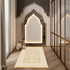 Cream and gold prayer rug with central arch medallion and geometric border