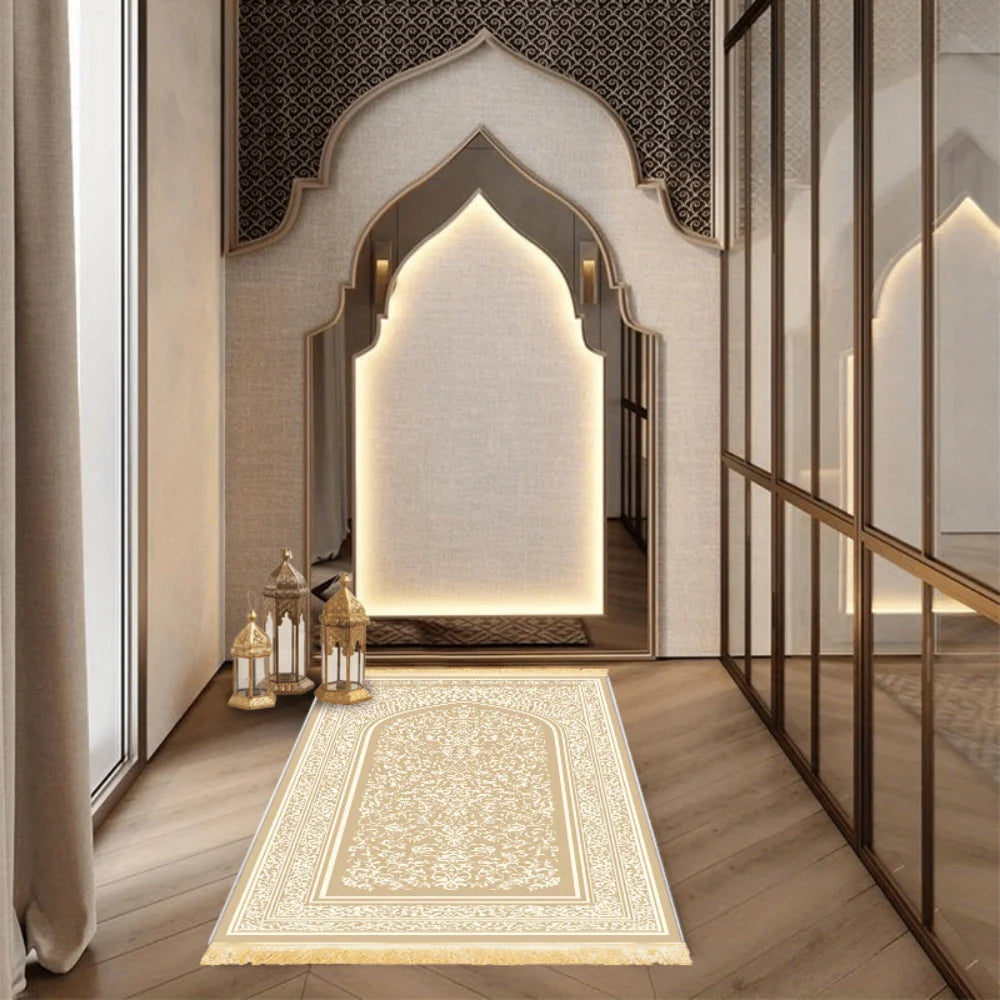Cream and gold prayer rug with central arch medallion and geometric border