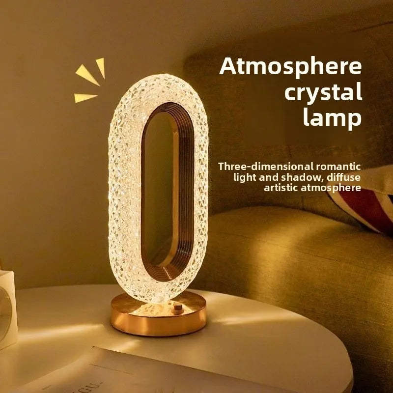 Pearl white crystal oval table lamp on nightstand with warm light glow
