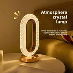 Pearl white crystal oval table lamp on nightstand with warm light glow