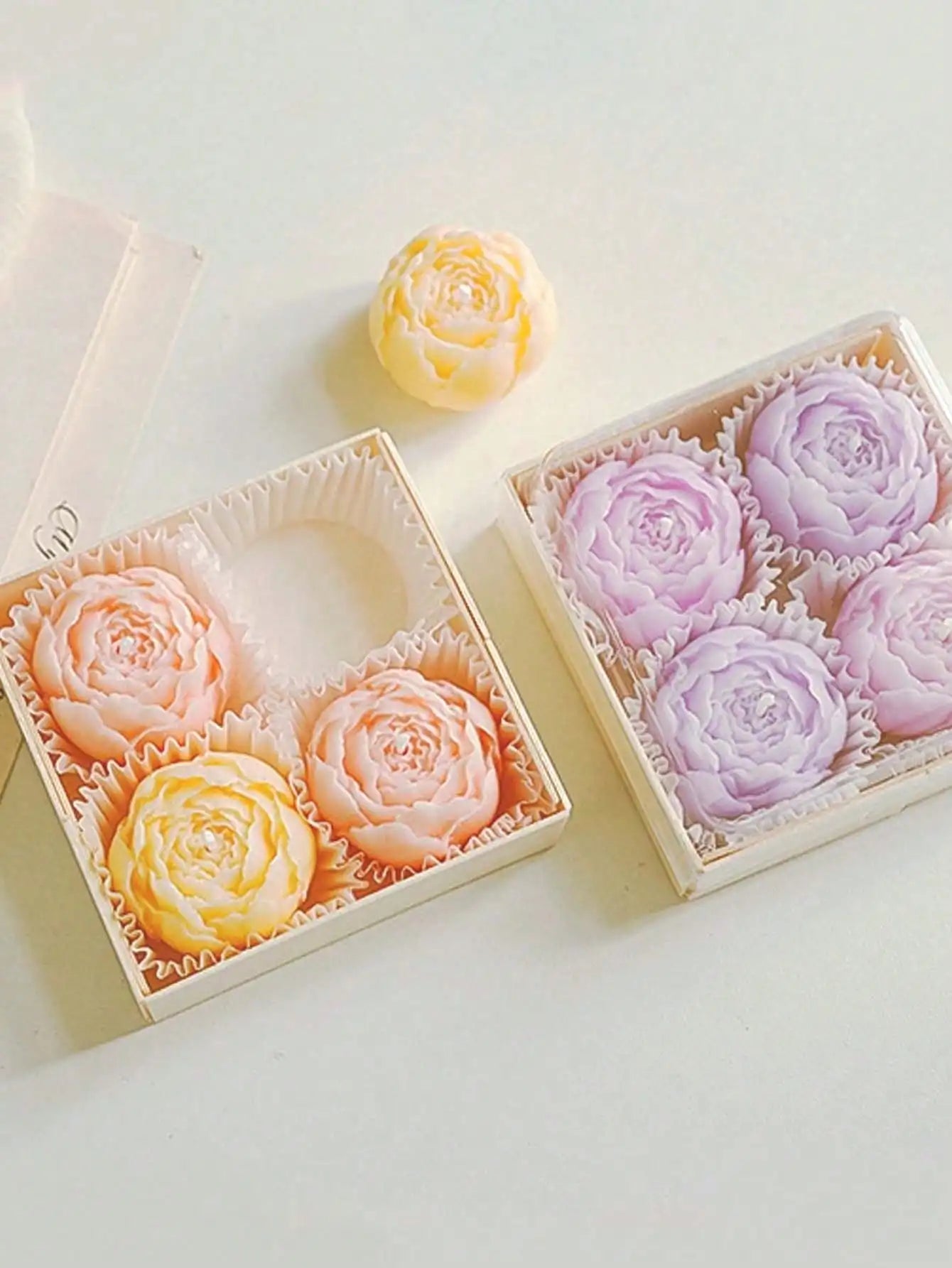Floral candle set: two gift boxes with yellow-orange and lavender rose candles
