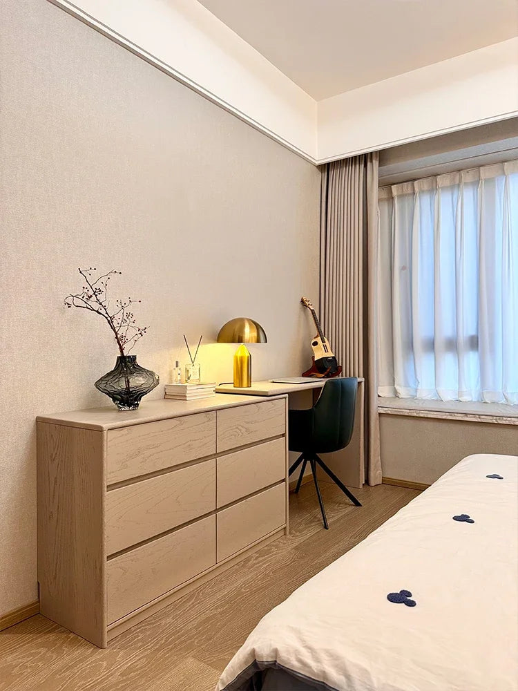 Gold mushroom LED table lamp with dome top and gold column base on dresser