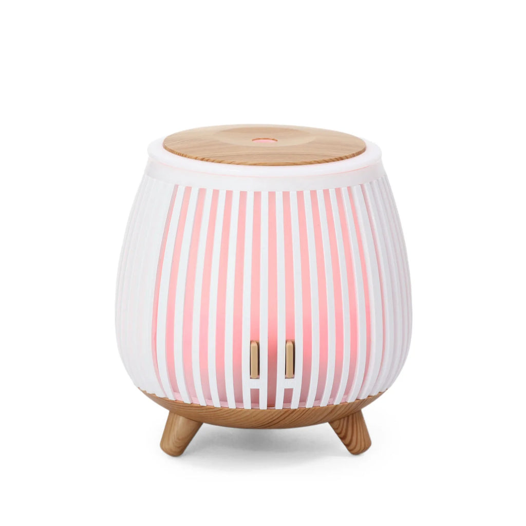Mini ultrasonic aroma diffuser humidifier with light wood top, white striped body, pink night light