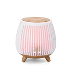 Mini ultrasonic aroma diffuser humidifier with light wood top, white striped body, pink night light