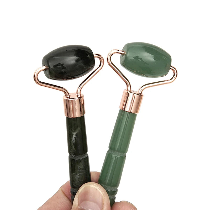 Jade roller massager with rose-gold U-frame, dark stone and forest-sage green handle