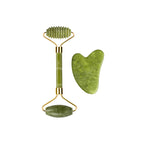 Jade roller with ribbed head and oval base, plus angled heart gua sha stone