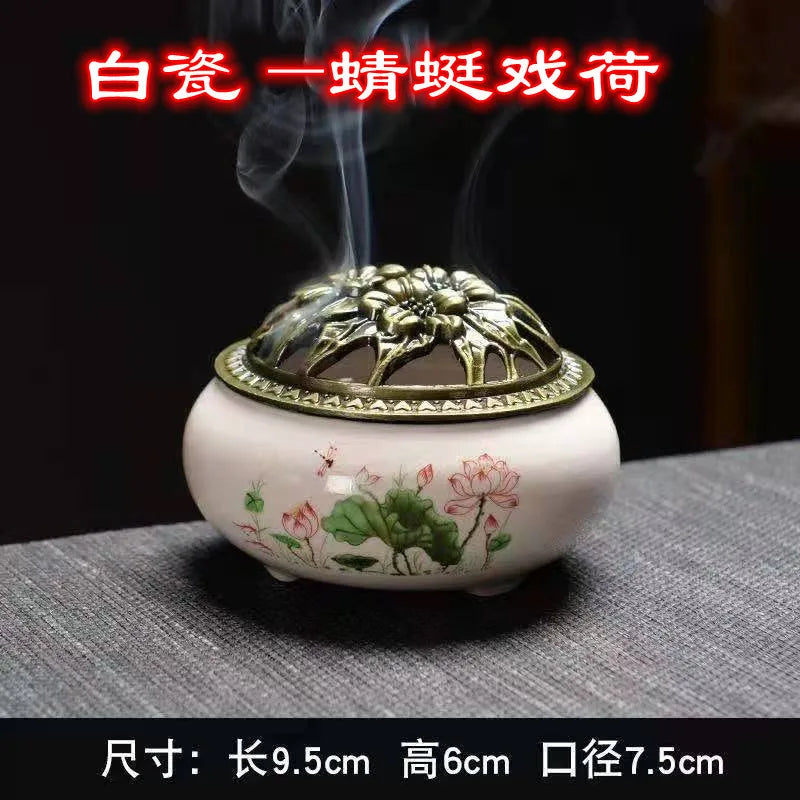 Ceramic incense burner with floral print, bronze dome lid, small round base