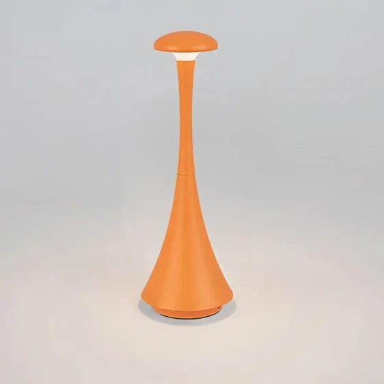 Amber glow cordless mushroom touch table lamp in warm orange, tapered body with lit top.