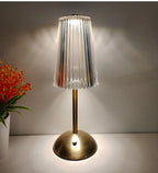 Cordless dimmable night lamp with ribbed clear lampshade and gold base
