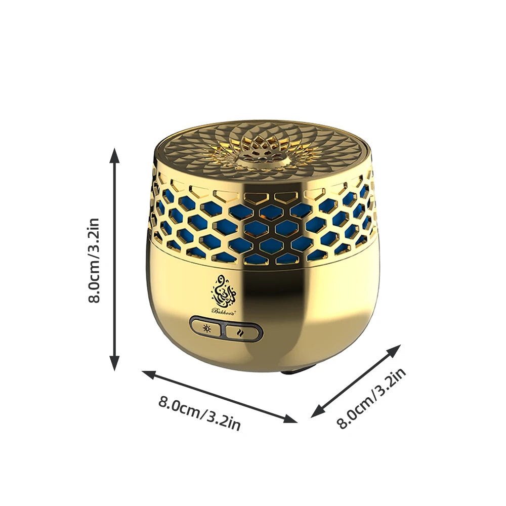 Gold electric bakhoor burner with hex-pattern top and control buttons on base