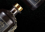 Close-up of reed diffuser neck with gold cap and twisted tassel cord