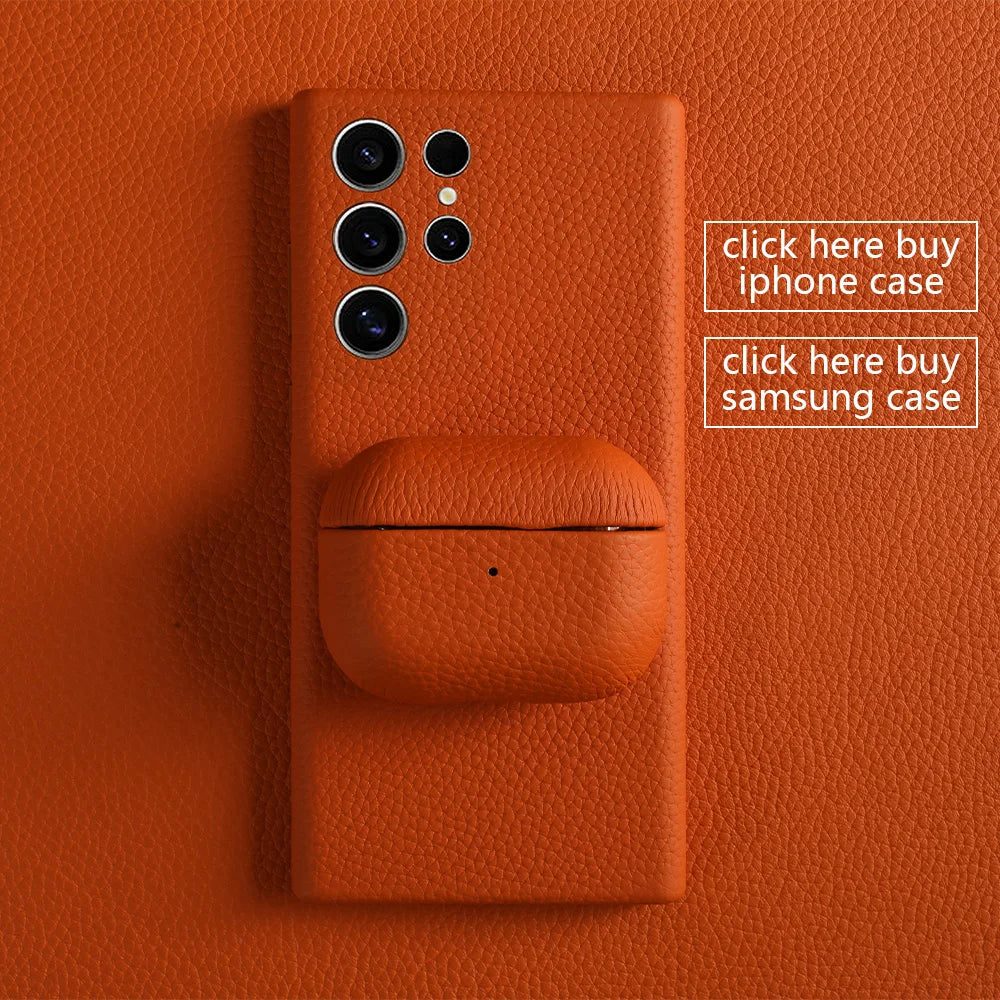 Orange leather AirPods snap case, closed with top seam and small dot detail