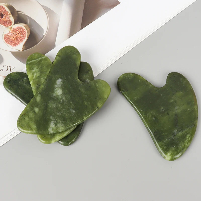 Heart-shaped jade gua sha massager, green Xiuyan jade with cutout handle notch
