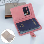 Blush pink vegan leather passport holder with window ID card slot and luggage tag strap