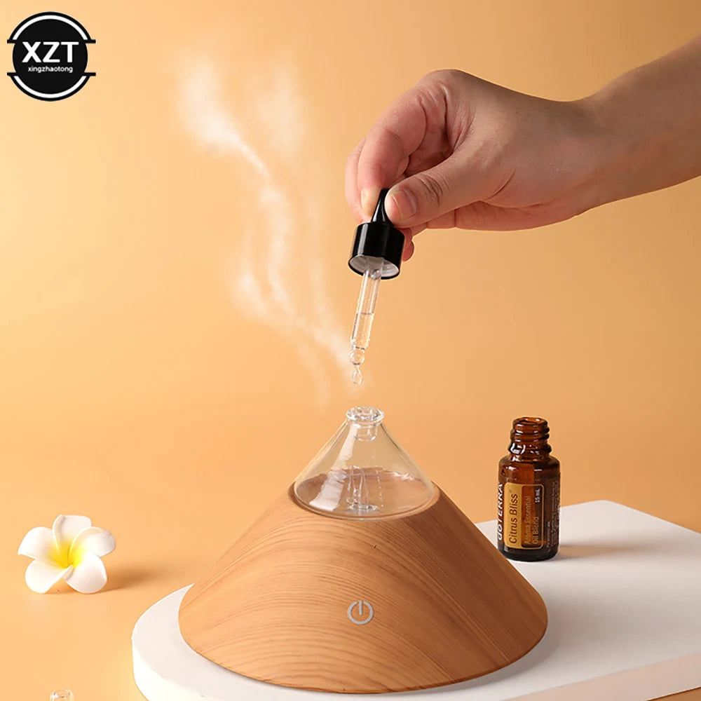 Wood grain compact aroma diffuser with glass top, mist stream and glowing power icon