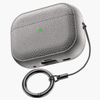 Gray leather-pattern AirPods case with keychain ring attached
