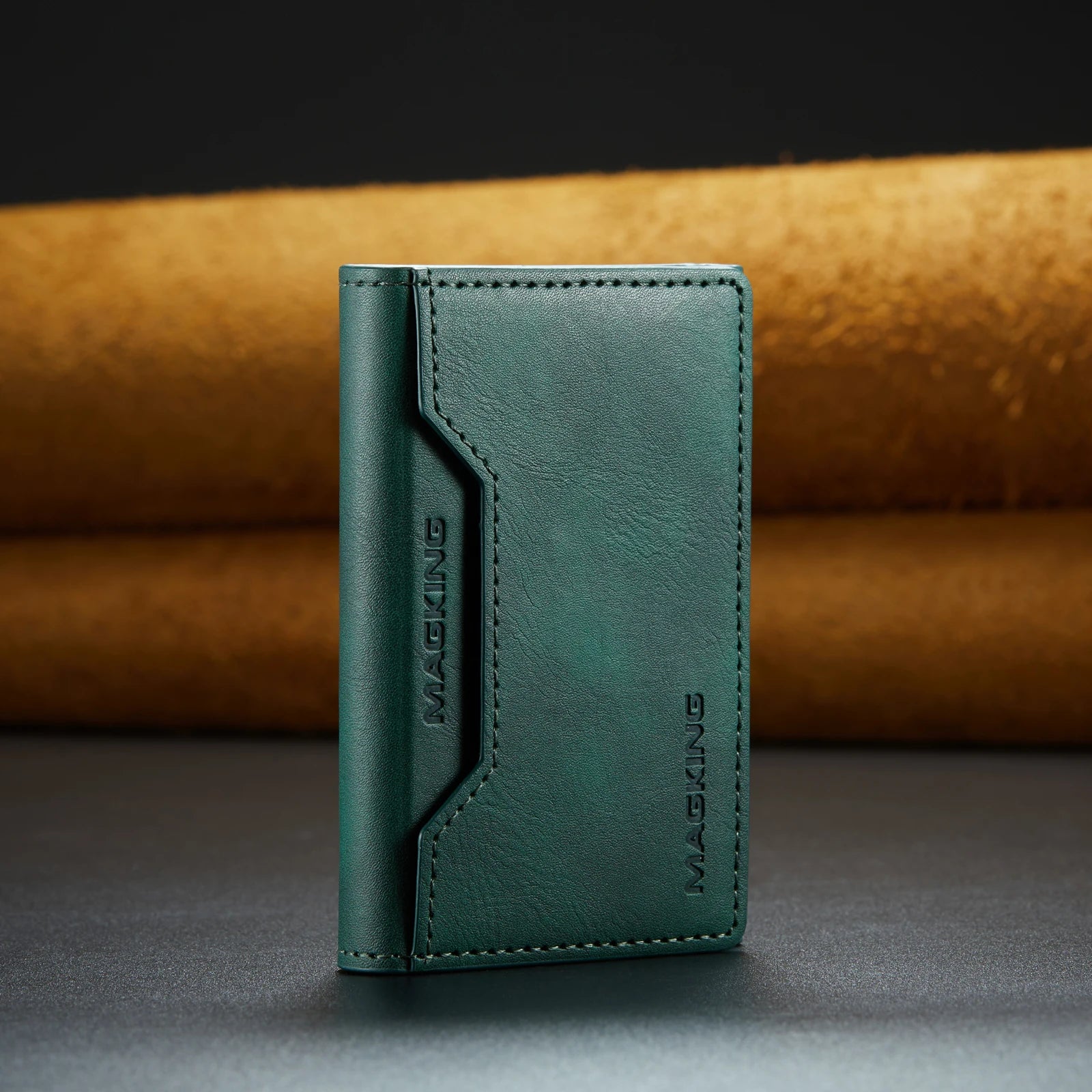 Green slim leather wallet with stitched front panel and brand logo.