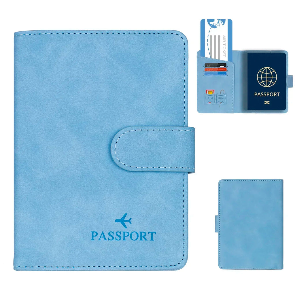 Sky blue RFID passport wallet with fold-over strap and stitched oval tab detail