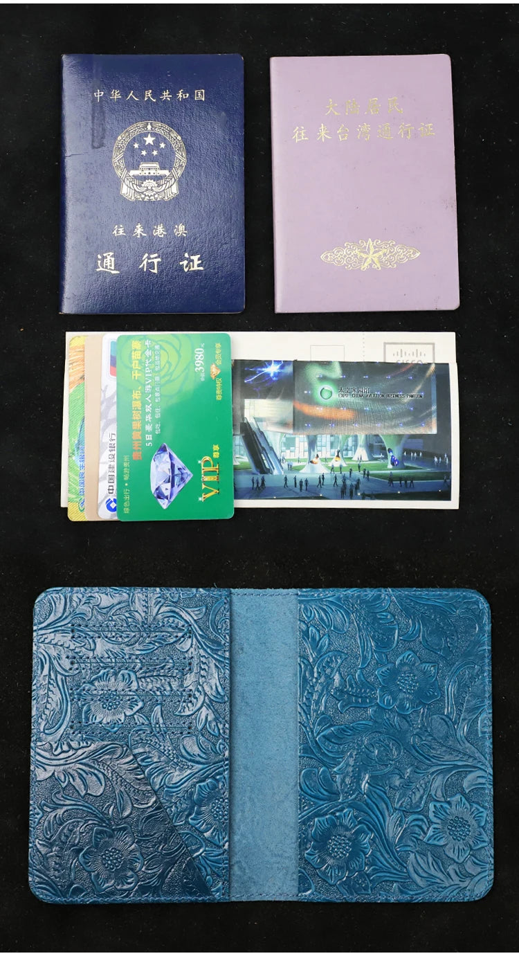 Blue leather travel folio with card slots, passport and ID cards laid on it