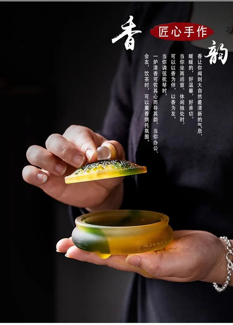 Incense vessel in hands with smoke and Chinese calligraphy text