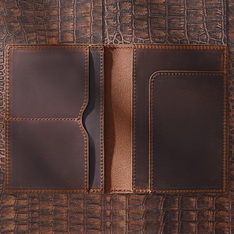 Brown passport wallet interior with two card pockets, center spine panel, and right slip holder