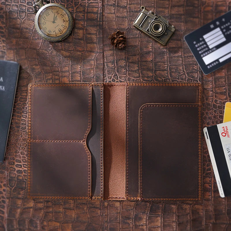 Brown passport wallet opened flat: left two pocket sections and two right card compartments
