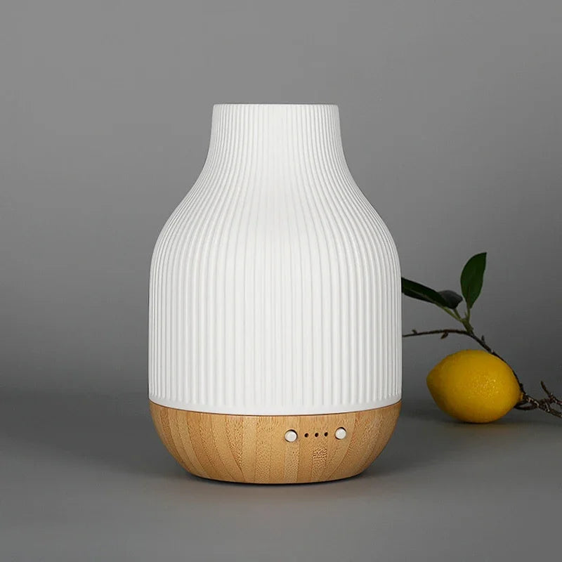 White ribbed ceramic aroma diffuser with wood base and three front control dots