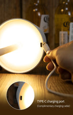 Close-up of charging port on glowing LED desk lamp, USB Type-C detail