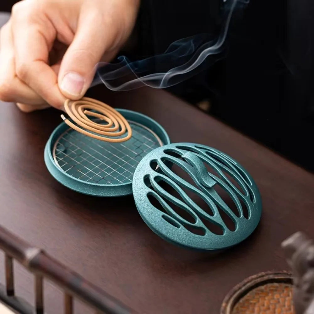 Blue zinc alloy hollow incense burner, spiral metal vent with rising smoke