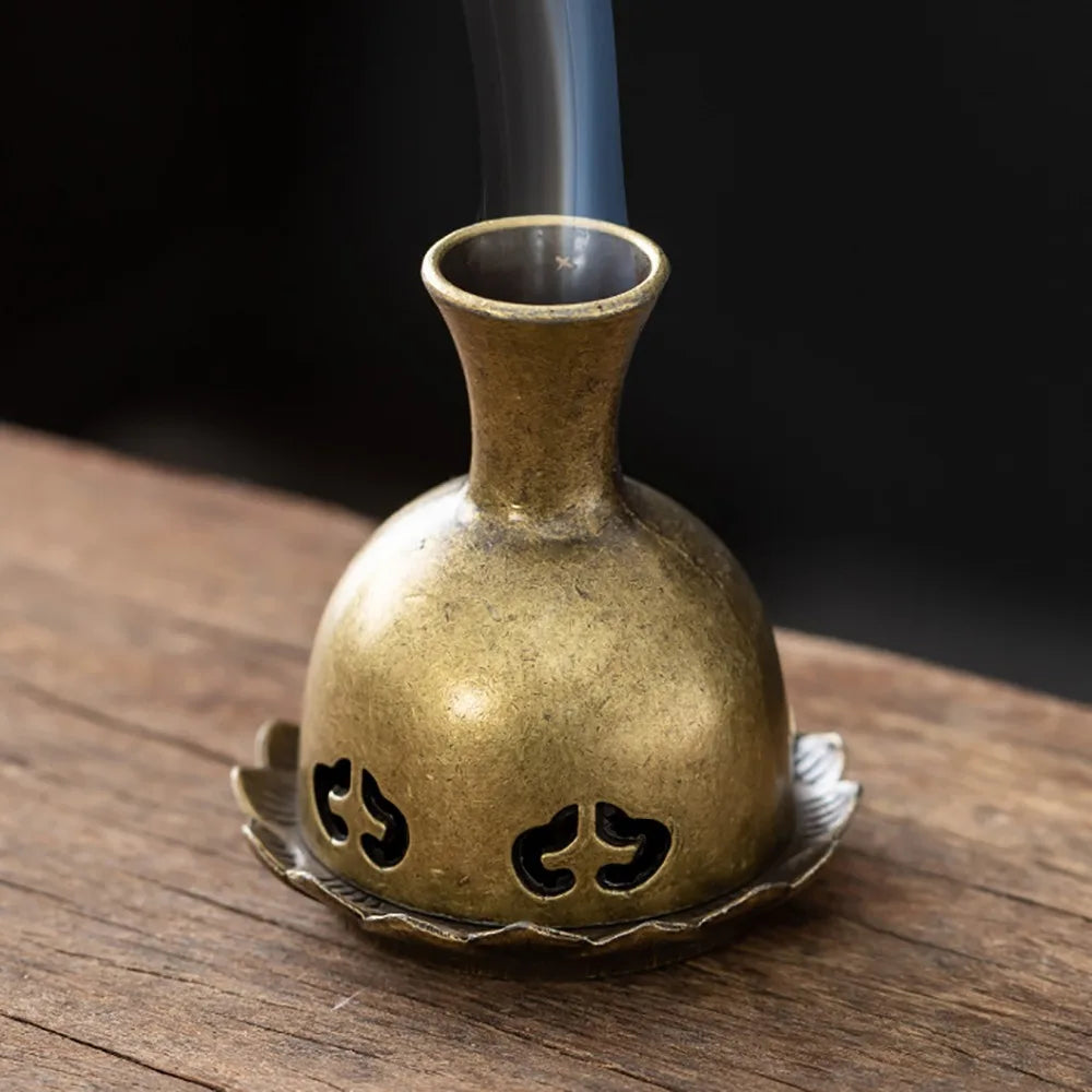 Brass incense holder vase with flame cutouts and wide circular base tray