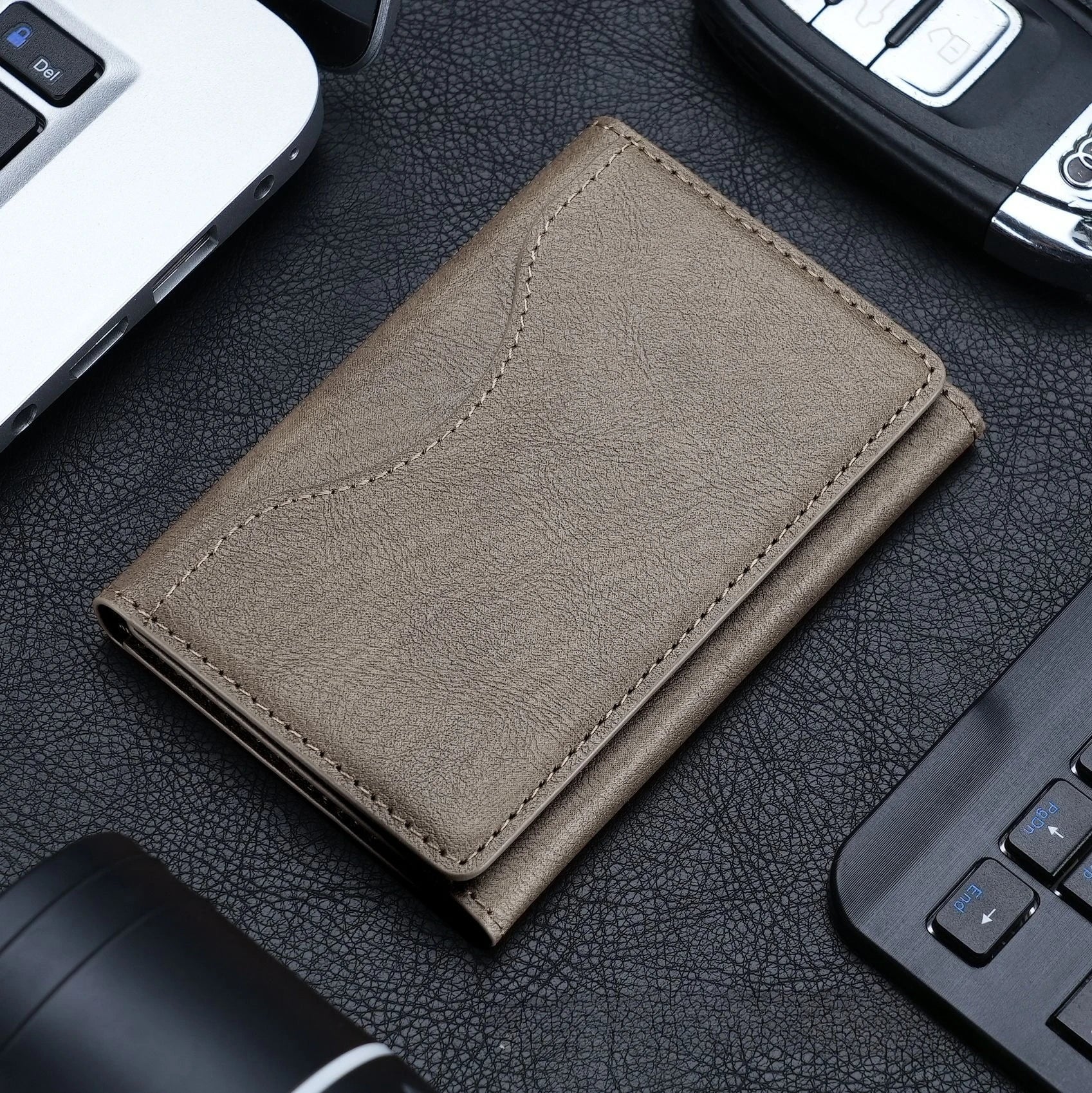 Magnetic pouch wallet in khaki leather with contrast stitching and front fold