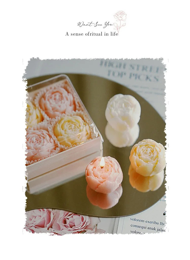 Rose-scented candle gift box with pastel rose candles and one lit candle