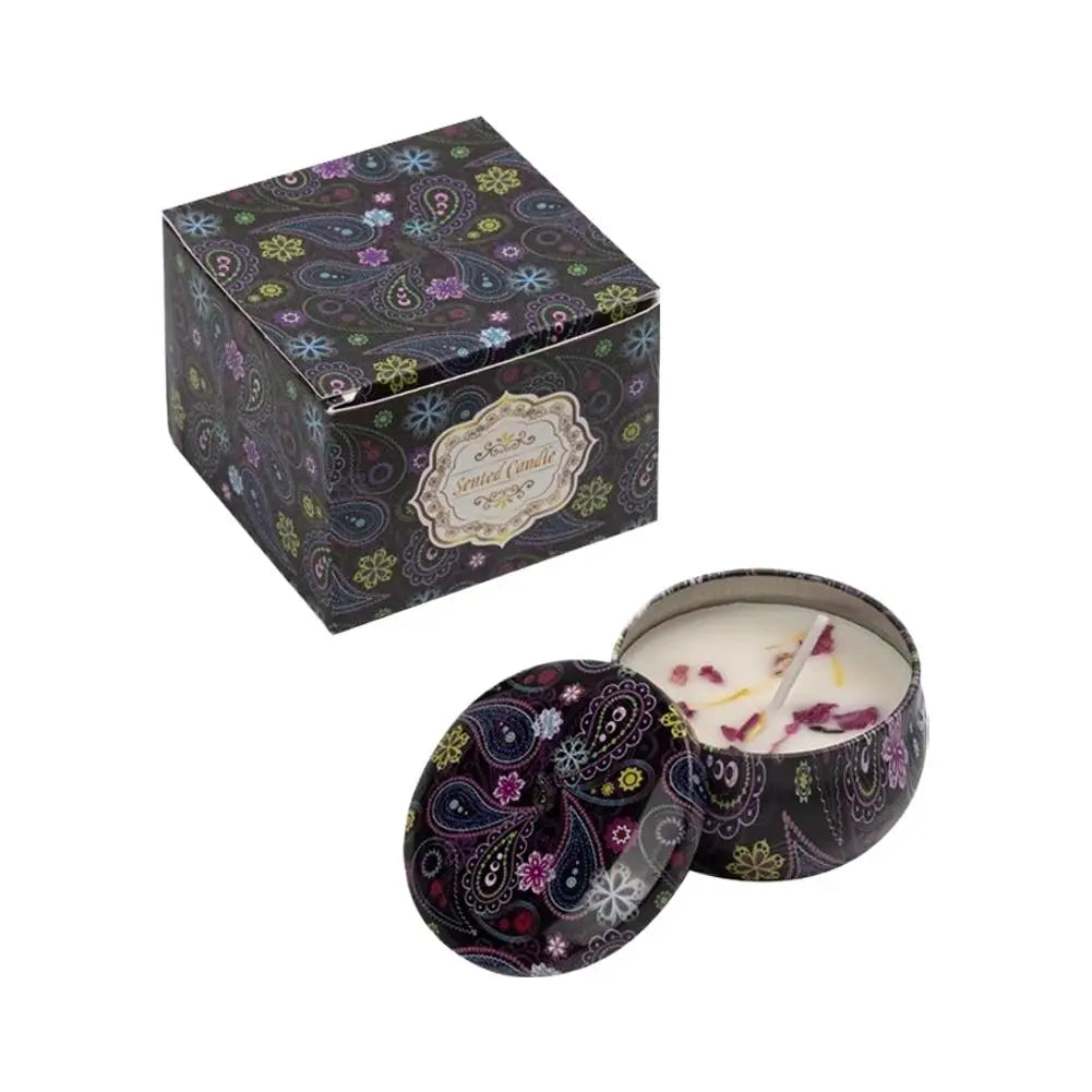 Vintage jar scented candle with dark floral pattern lid and pale wax with petals