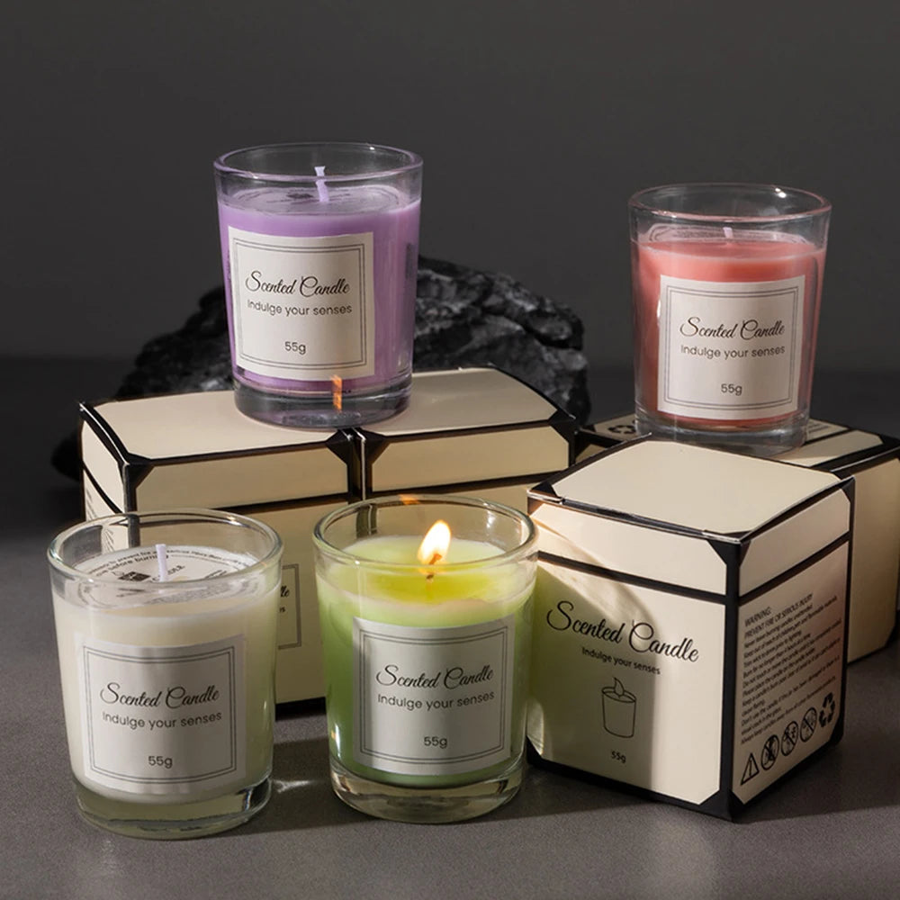 Aromatherapy candle gift set with lit purple, green, and orange candles
