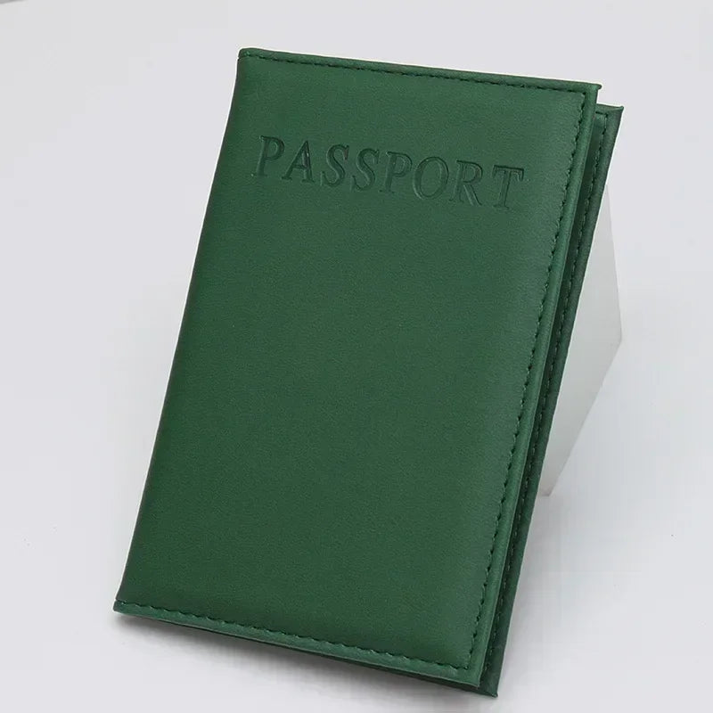 Dark green passport sleeve with embossed “PASSPORT” logo and stitched border