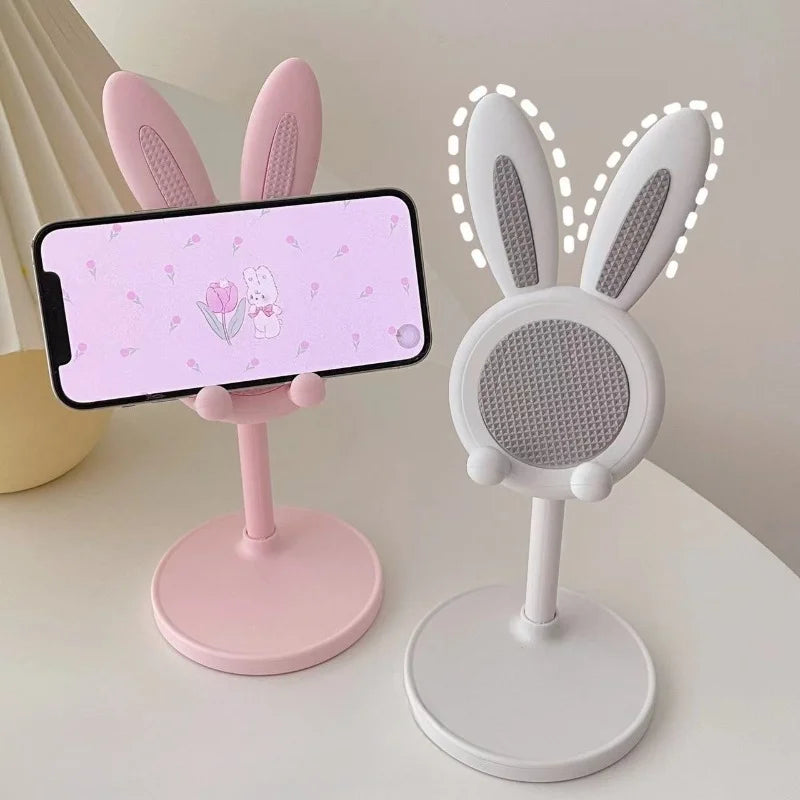 Two rabbit lift phone stands: blush pink and pearl white, round bases and mesh ear pads