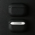 Obsidian black handmade leather AirPods case with AirPods exposed