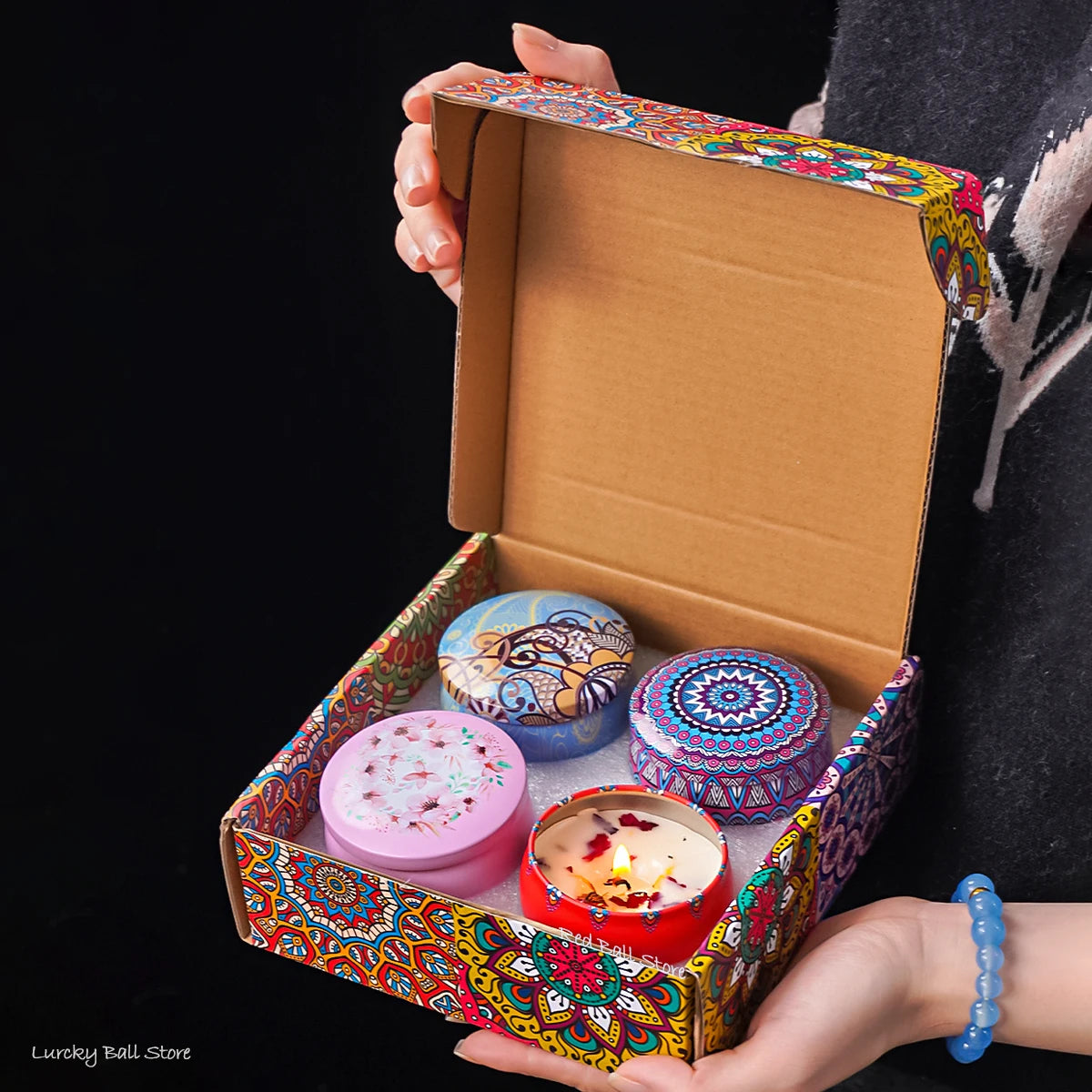 4-piece scented candle gift set in open box with colorful Arabian pattern lids