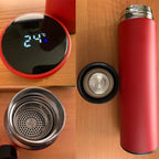 Red insulated thermos bottle with digital temperature display and open spout