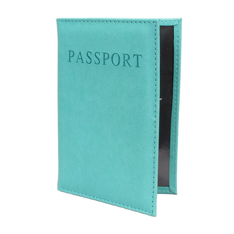 Sky blue passport sleeve with embossed “PASSPORT” and dark inner panel
