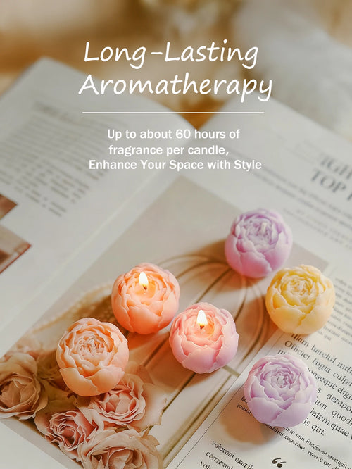 Rose-scented candle set: pastel rose candles arranged on a book with a boxed set