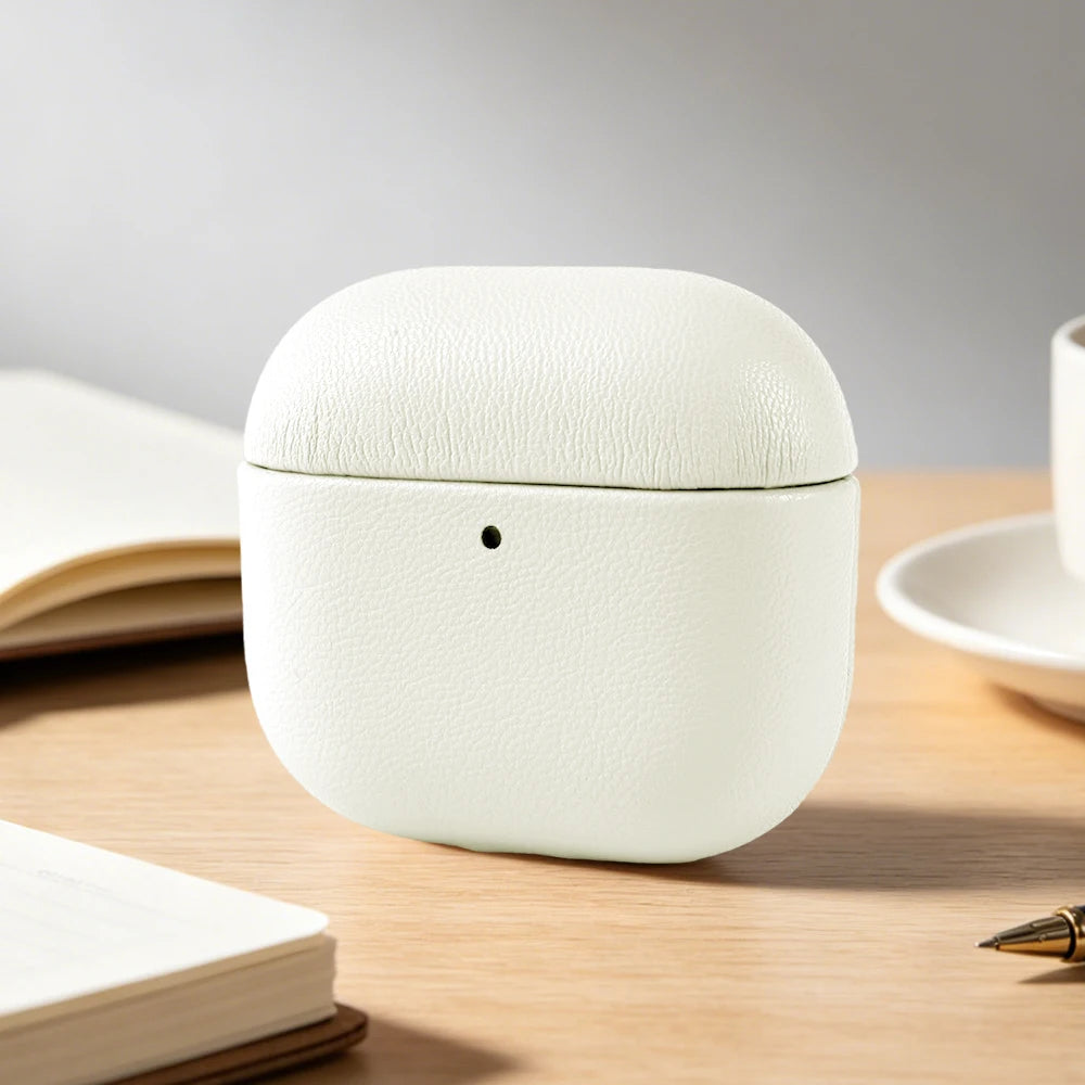 Pearl White eco leather AirPods case, closed front view with centered pinhole