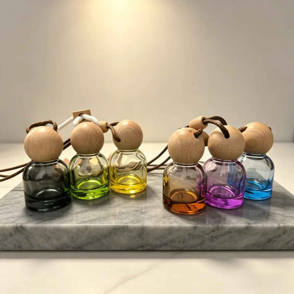 Glass car perfume diffuser: multi-color bottles with round wooden caps on cords